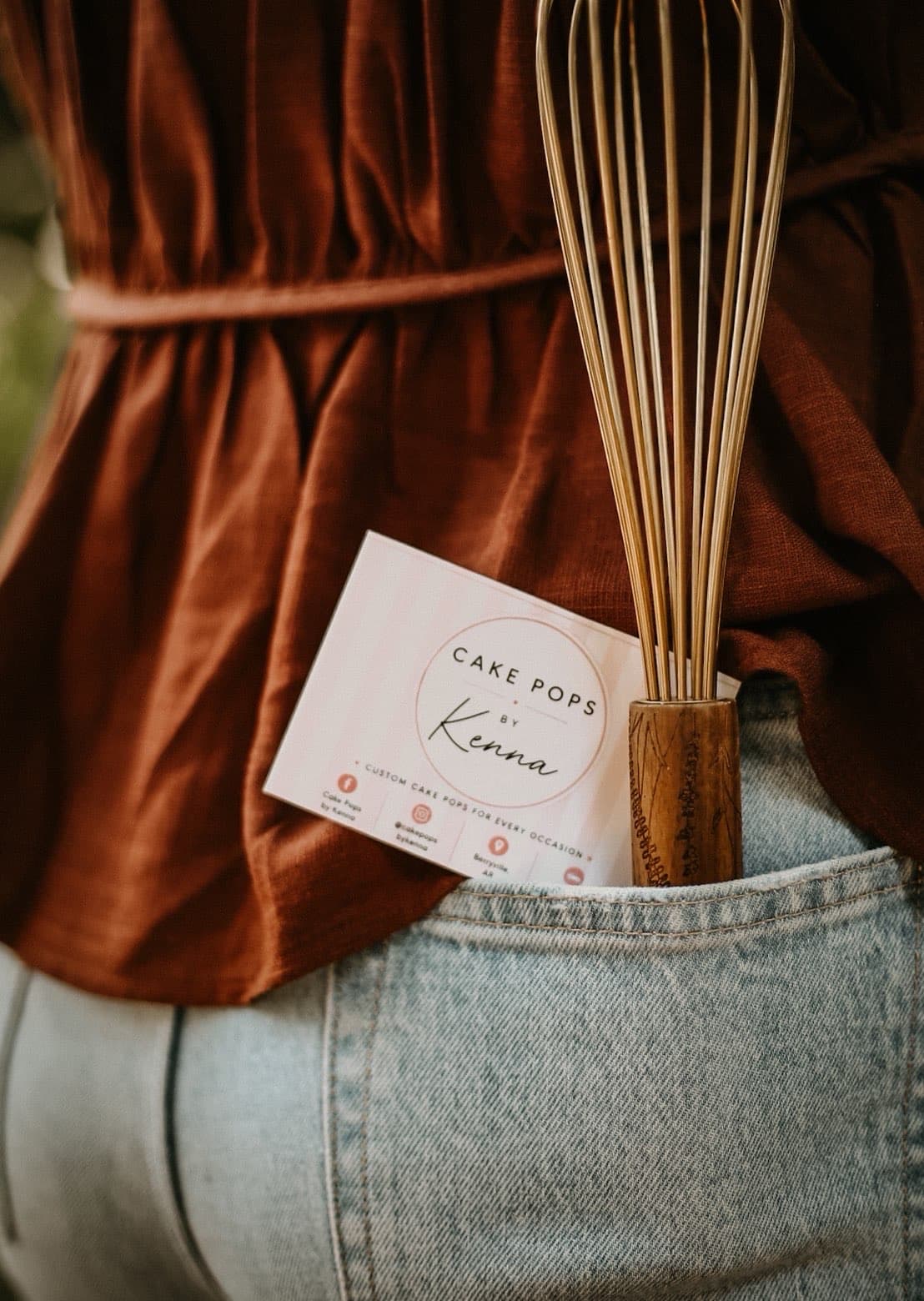 Cake Pops by Kenna business card tucked with a whisk
